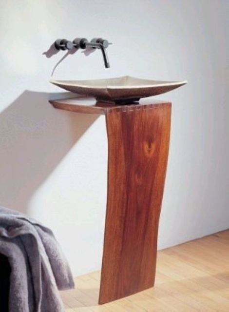 a wooden slab L pedestal sink stand like this one is a very cool and chic idea for a modern space, it may be used in other spaces, too