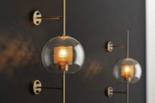 catchy brass wall lamps of glass spheres and mini lampshades inside look chic and very bold