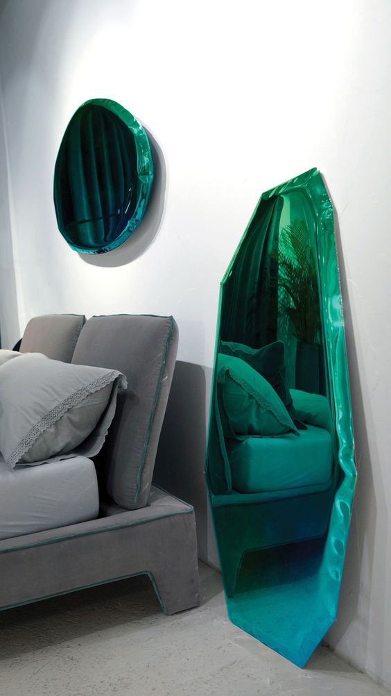 fabulous green mirrors of irregular shapes look like liquid metal placed on the floor or wall is a gorgeous idea