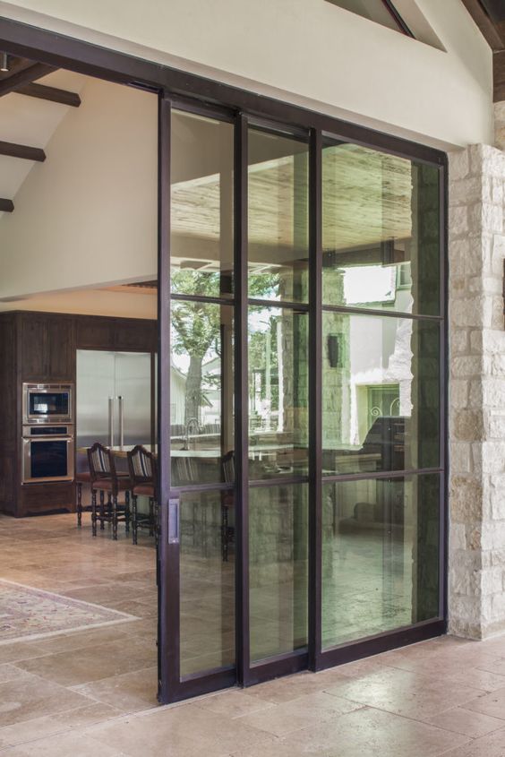 glass sliding doors are great to separate the indoor and outdoor spaces and brings much light inside