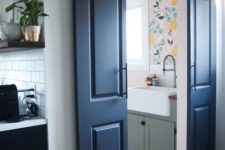 navy double barn doors with handles welcome entrance to the laundry and add a rustic feel