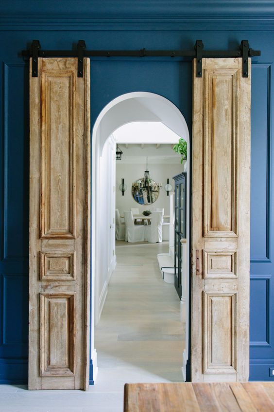 such antique doors made sliding ones add chic and a bold look to the space