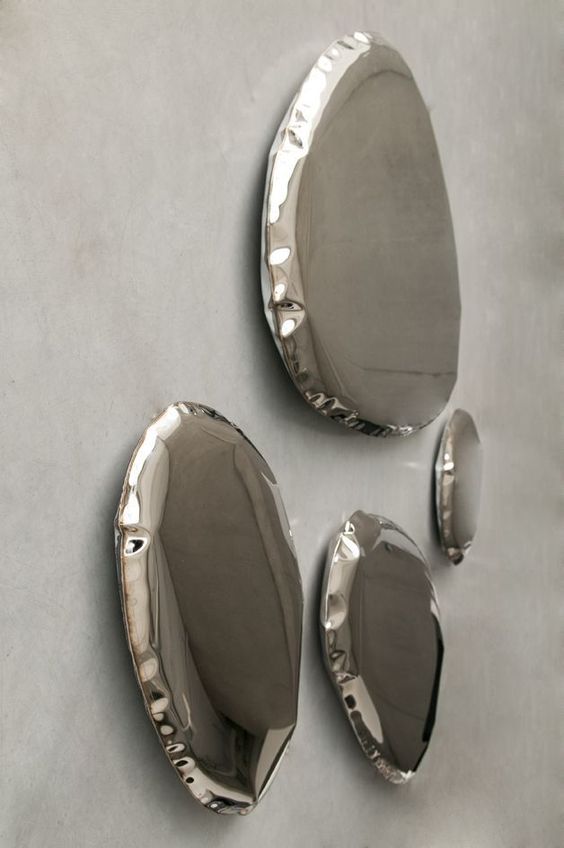 very edgy and lovely silver mirrors with edges that show off textile textures look wow and cool and will be a gorgeous solution for a modern space