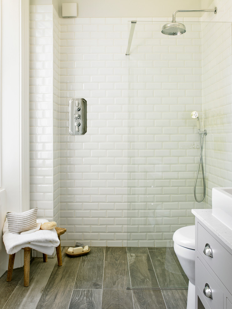 mixing rustic-looking faux wood tiles with plain white subway ones is a great way to create an interesting decor (LEIVARS)