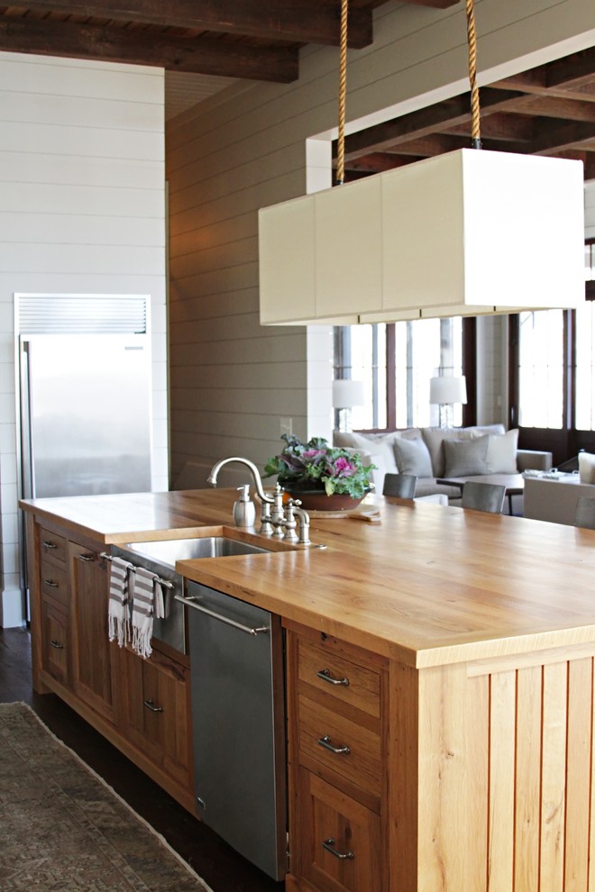 A solid wood kitchen island with a stainless steel dishwasher. (Yvonne McFadden LLC)