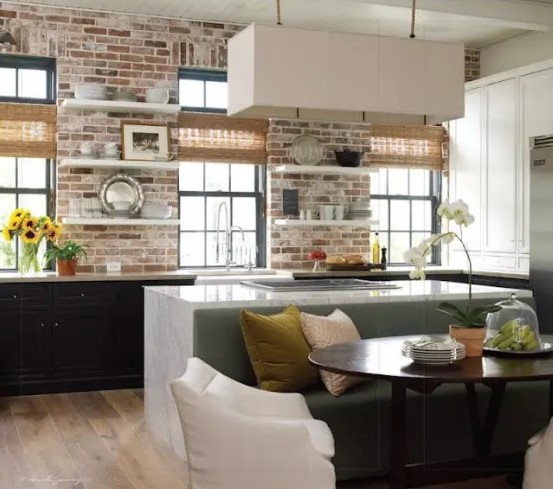 whitewashed bricks contrast the black cabinets and highlight them at the same time