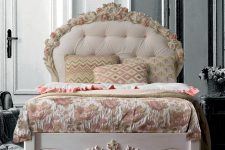 01 Luigina bed with a hand-carved floral headboard completed with floral bedding
