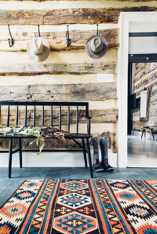 Rustic rough wood covers many walls throughout the house