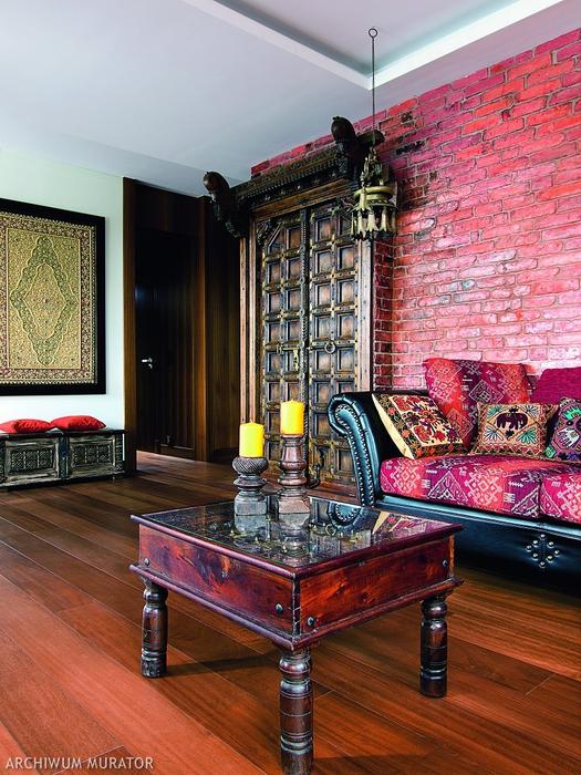 The furniture is made of mango wood, and the sofa is upholstered with ethno fabrics