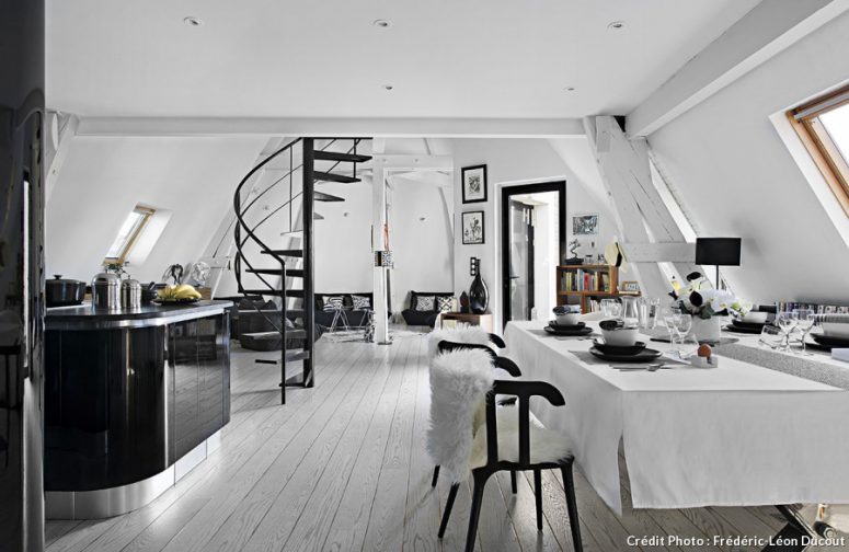 There are a kitchen, a dining and a living space on the lower floor