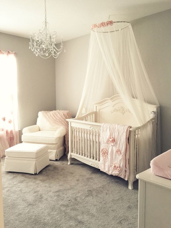 ivory crib canopy with artificial flowers