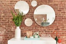 04 The exposed brick wall gives the space charm and character