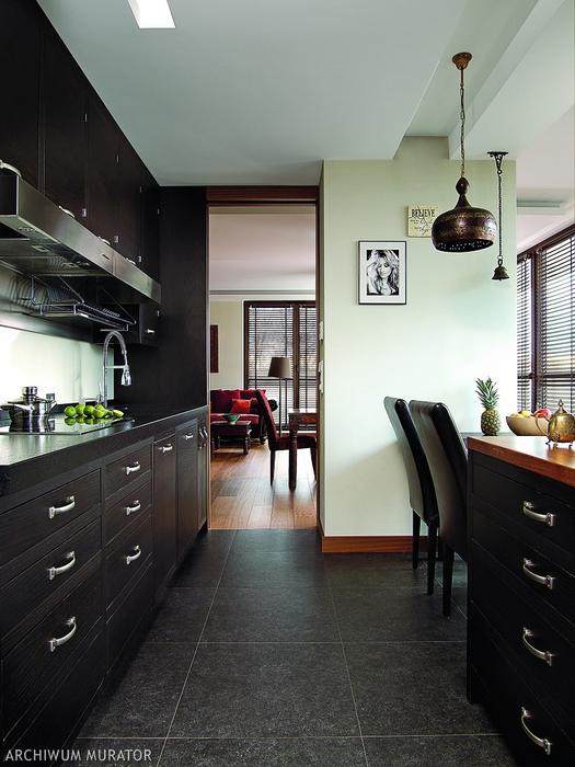 The kitchen is clad in black oak