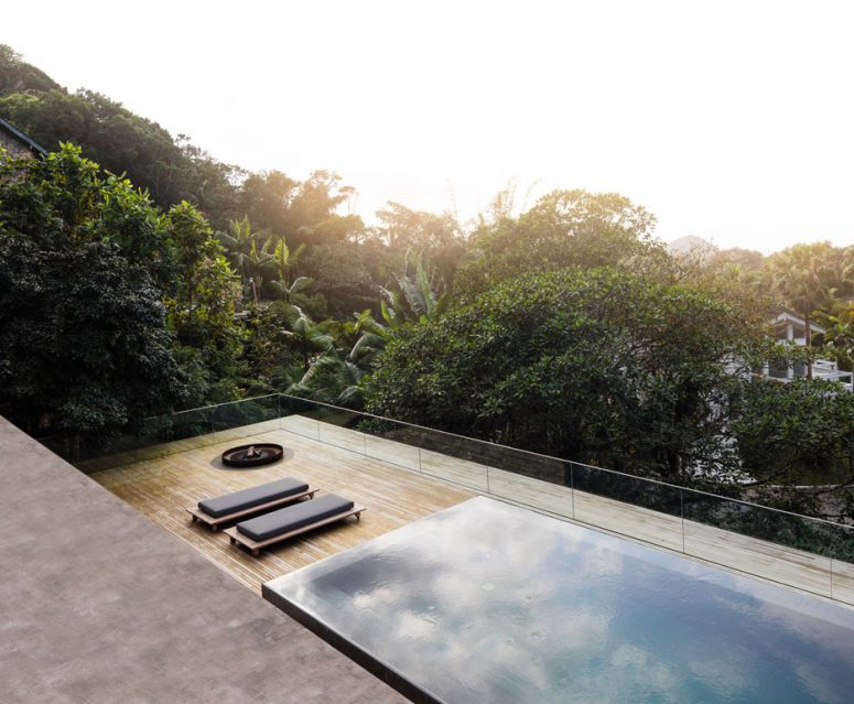 The pool is partially submerged into the floor but has a raised border