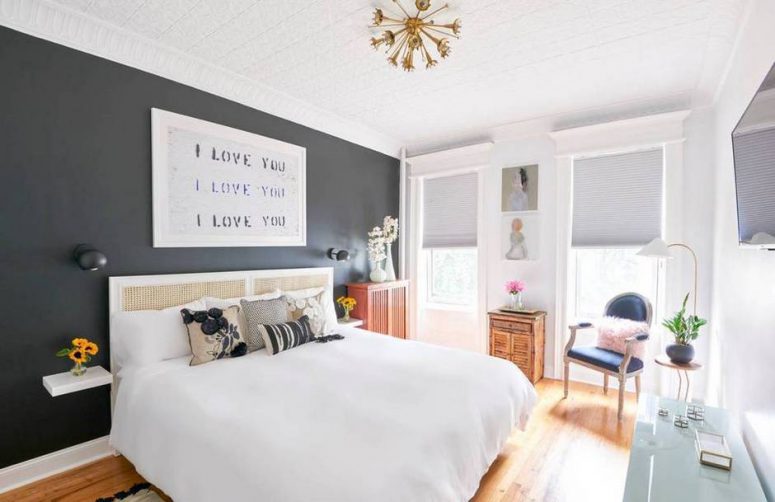 There's a black accent wall in the bedroom