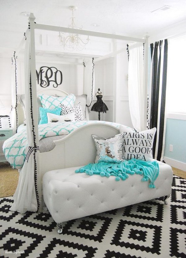 royal large bed with draperies for privacy and an upholstered bench