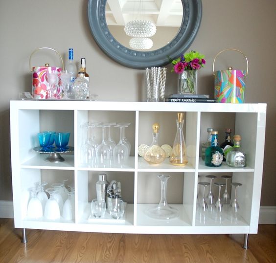 an IKEA Kallax shelf is perfect for glasses storage, it can easily become a nice home bar or just a dish and glass display