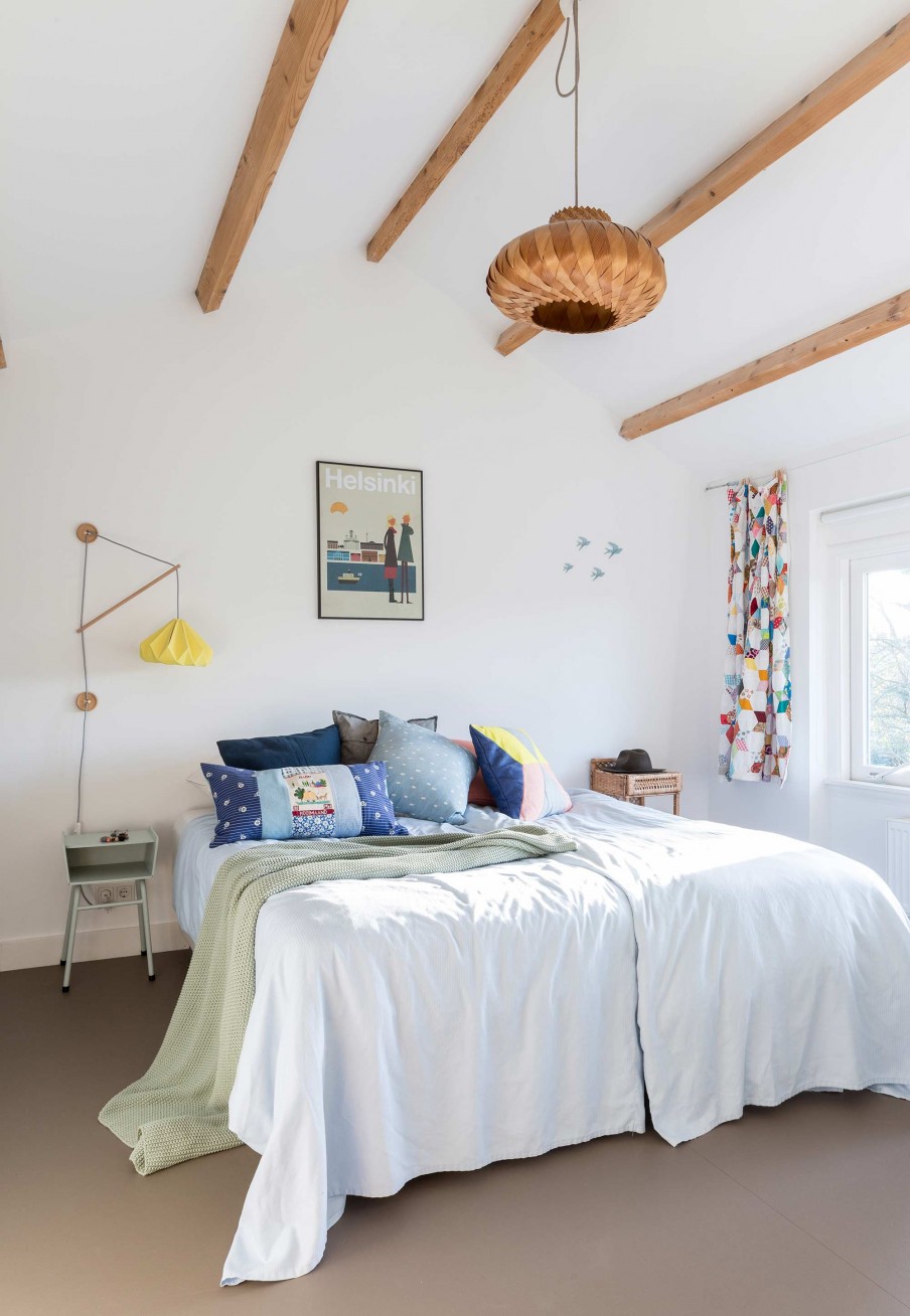 The master bedroom is serene and fun with crazy nightstands and bold accents
