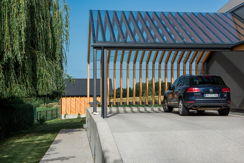 The shortest roof is extended to cover the carport as there are several cars and one garage isn't enough