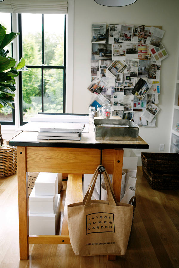 The office is designed with five large double-hung windows