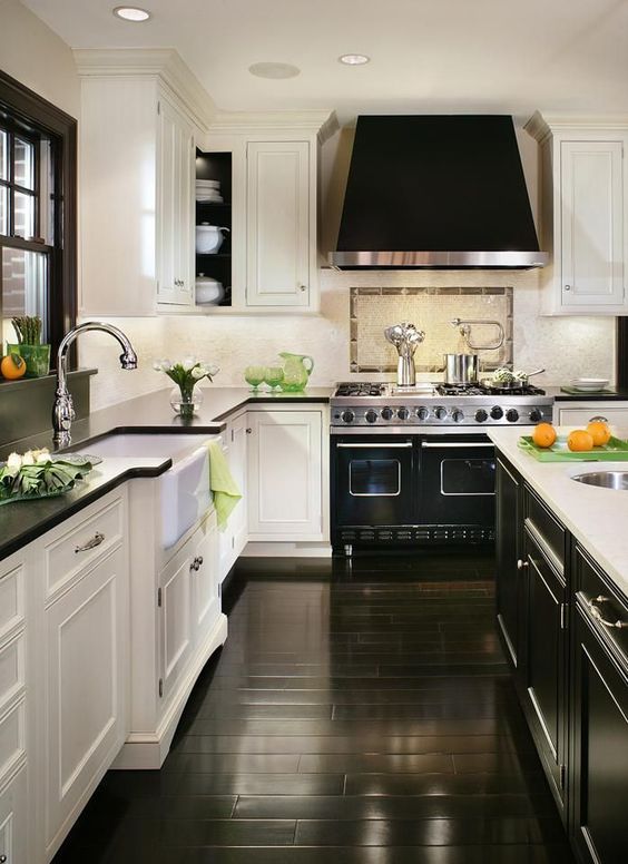 polished black lamitate flooring complement the design of this art deco kitchen