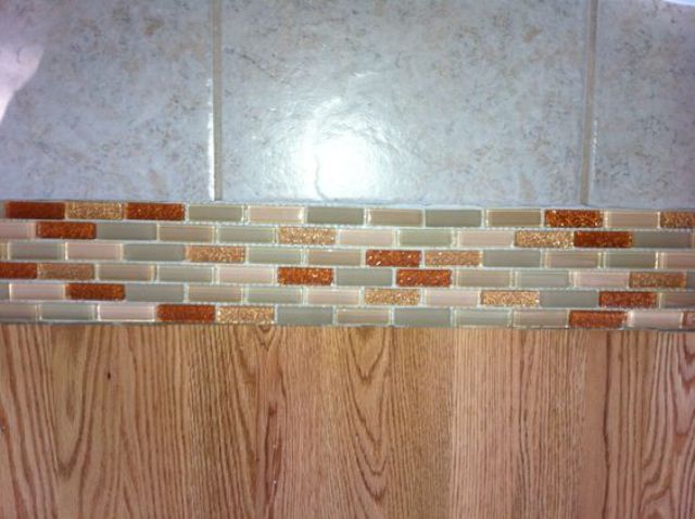 13 Glass tile transition between floors instead of wood or marble