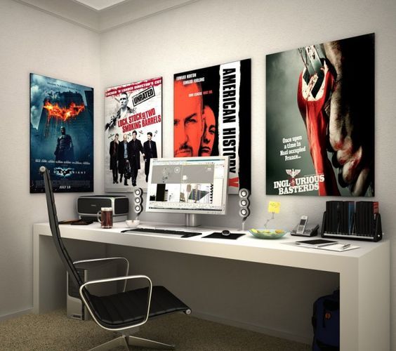 modern study area with posters of favorite comics and films