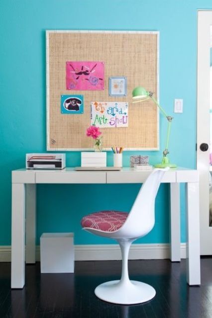 bold modern study space with a sleek white desk and a pinboard