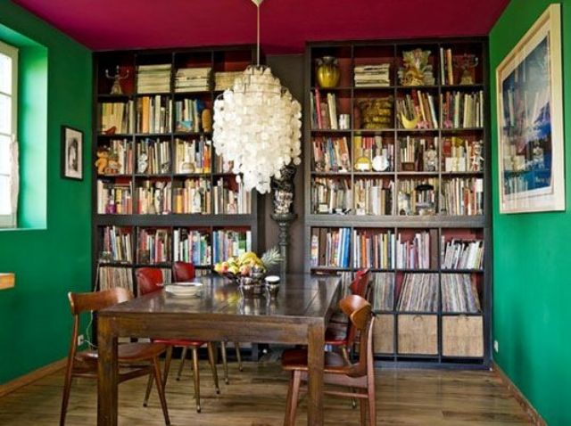 Green walls and a red ceiling in the library