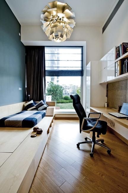 wall-mounted desk and shelving for a long and narrow room