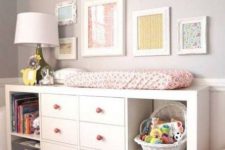19 IKEA Kallax changing table with pink knobs