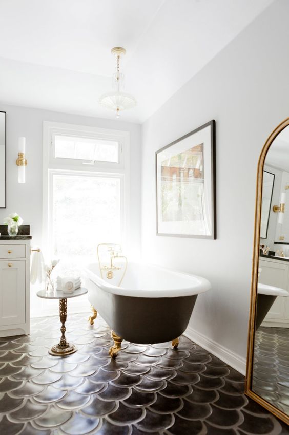 these black scallop tiles totally make the bathroom