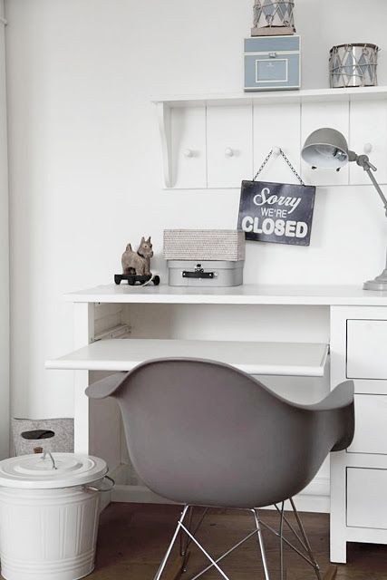 all-white study with several shelves and drawers