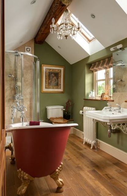 Sage green bathroom with a red free standing bathtub
