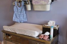 23 mirror changing table with a rack over it