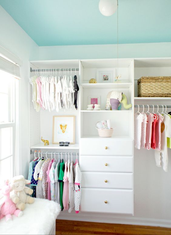 open kids' closet with drawers for folded things