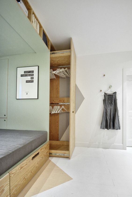 pull-out closet solution next to the bed