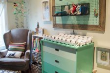 28 ombre mint changing station with a pegboard storage above it