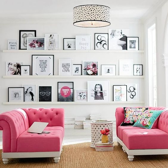 glam hangout nook with pink sofas and a gallery wall