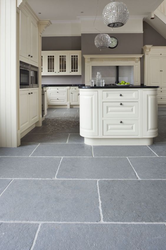 32 in the kitchen stone floors are perfectly functional and practical