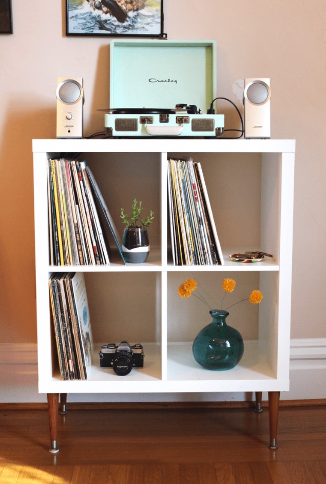 a DIY vinyl record shelf from Kallax, with stained legs and some decor is a lovely idea of a small media console