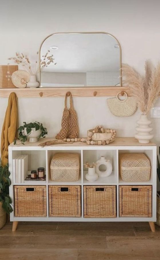 a boho chic storage unit made of an IKEA Kallax piece with storage baskets and a wooden countertop is a perfect idea for a boho space