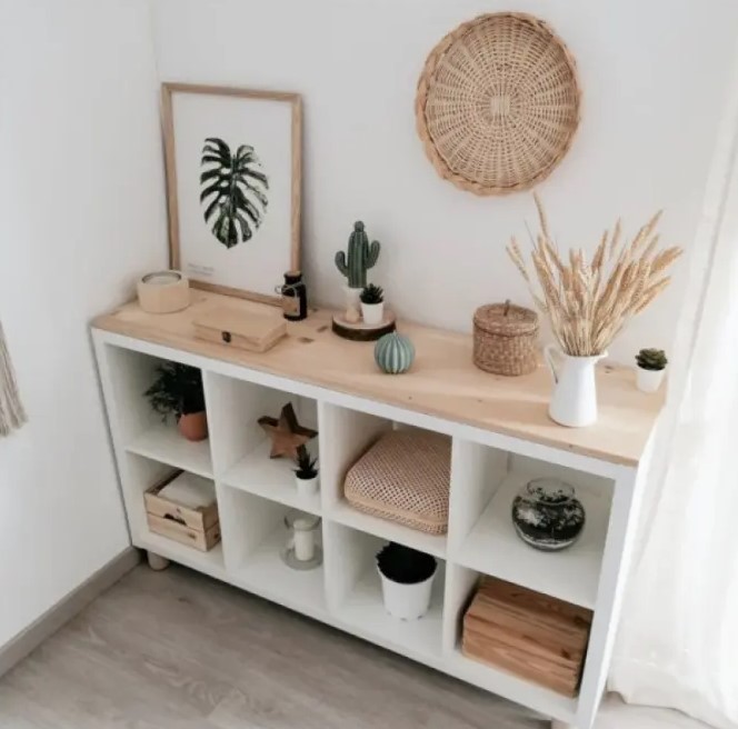 a chic boho storage unit of an IKEa Kallax shelf, with wooden boxes and some lovely decor on top is amazing