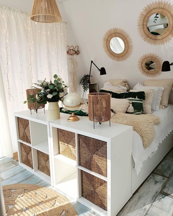 a couple of IKEA Kallax pieces with jute storage drawers are a great storage footrest of the bed for a boho bedroom