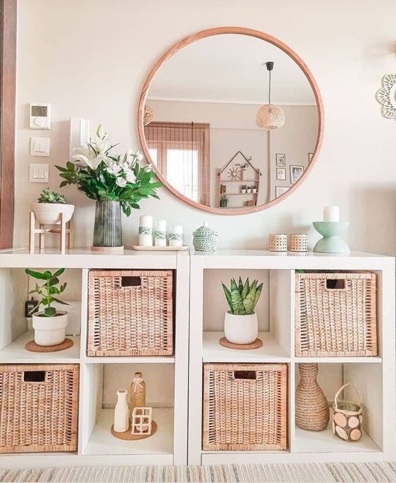 a couple of IKEA Kallax units with woven drawers and potted greenery is a cool solution for a boho or Scandinavian space