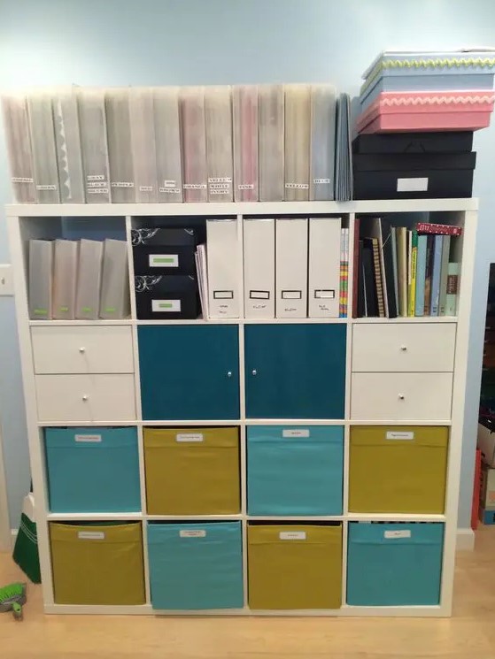 a home work station of an IKEA Kallax finished off with colorful IKEA Drona boxes is a cool storage idea for your home