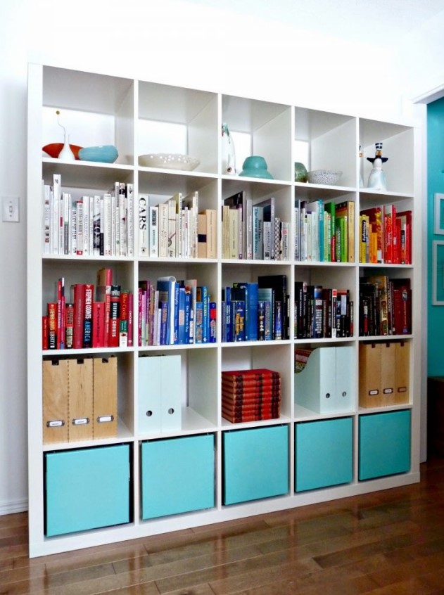 an IKEA Expedit piece with turquoise cubbies, folders, colorful books and some decor is a lovely solution
