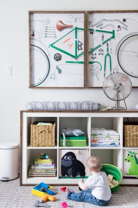 an IKEA Expedit storage unit covered with stained wood is a cool changing table, too