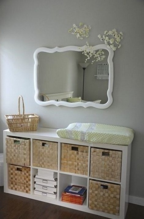 an IKEA Kallax shelf with woven baskets as drawers is a chic rustic changing table with a cozy feel