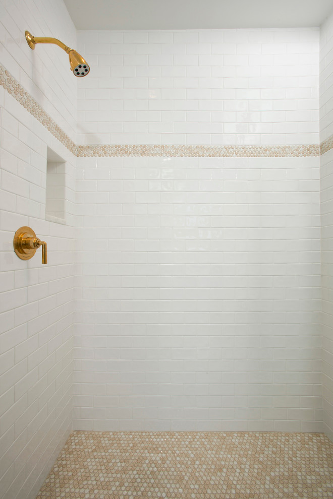 penny round tiles are used as for floor as to create an accent on the shower's wall (Braswell Design+Build)